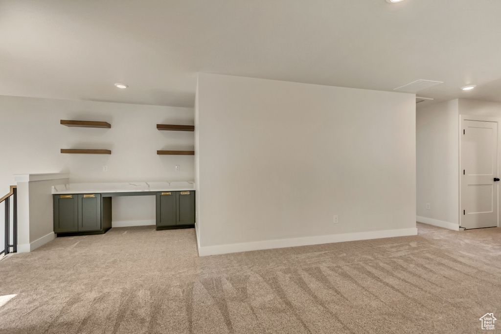 Spare room with light colored carpet