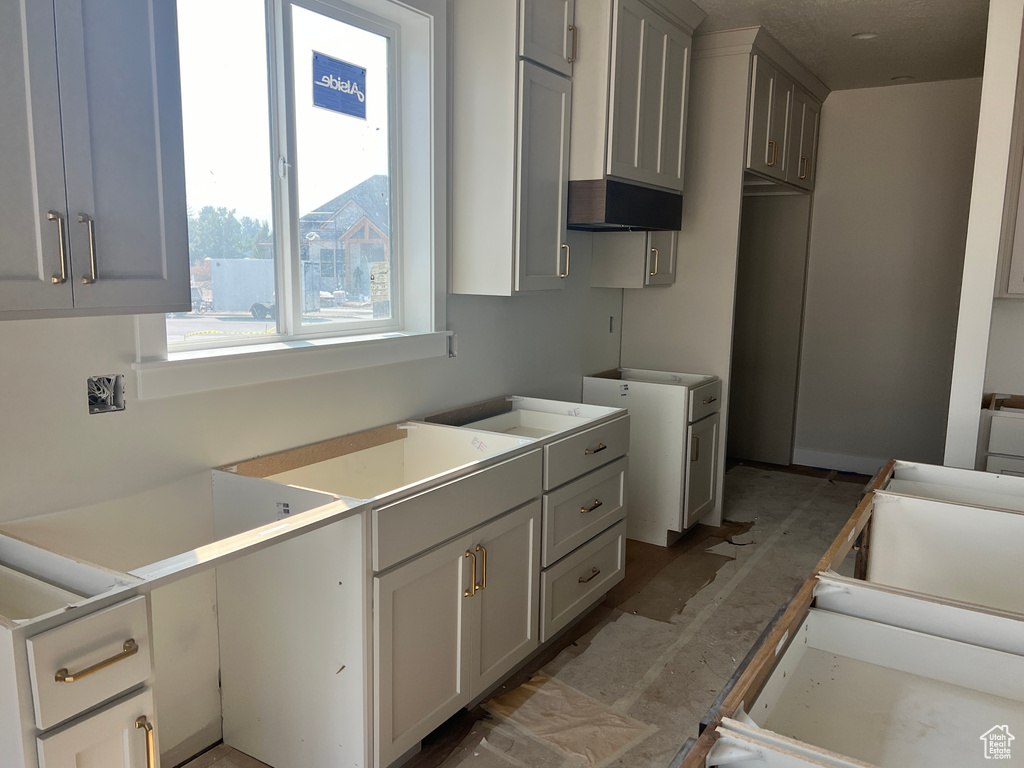 Kitchen featuring gray cabinetry