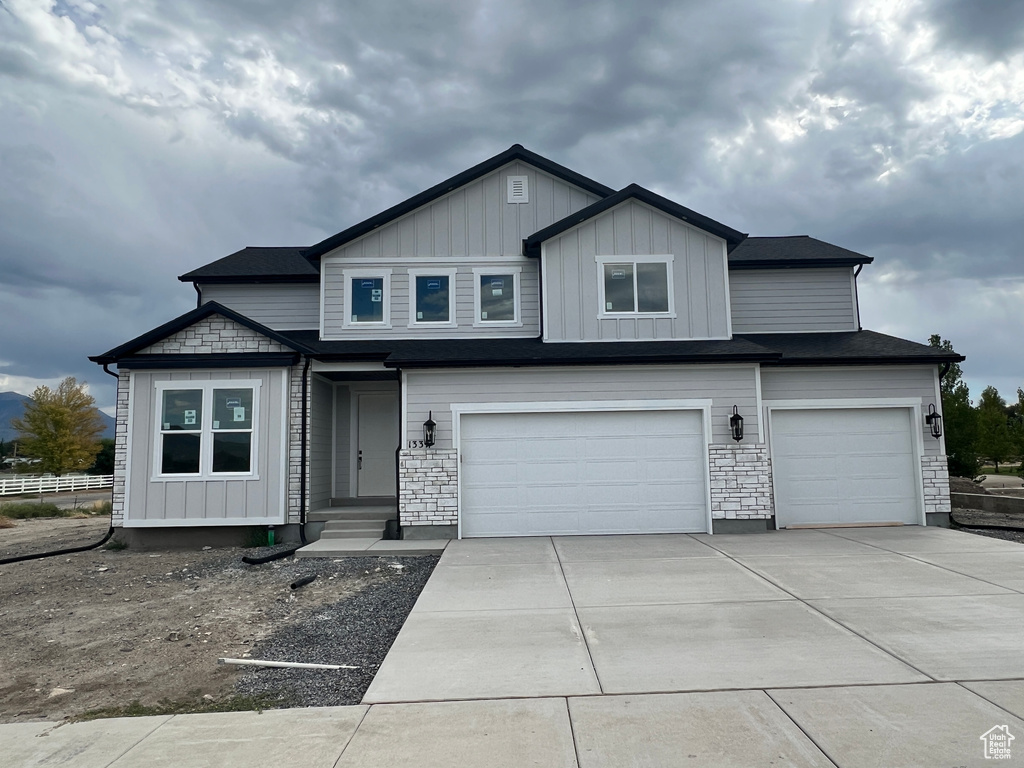 View of front of home featuring a garage