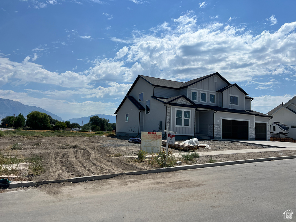 View of front of house featuring a garage and a mountain view