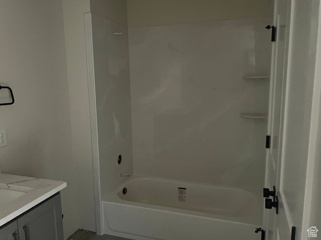 Bathroom featuring vanity and shower / bathtub combination