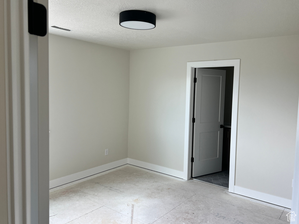 Spare room featuring a textured ceiling