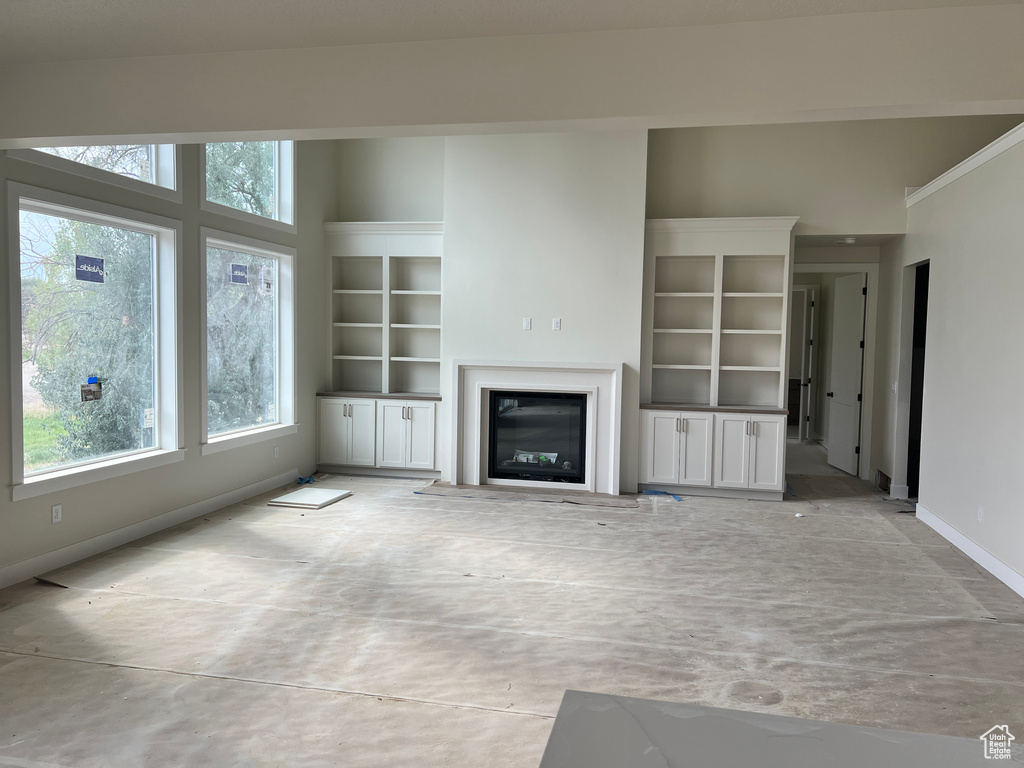 Unfurnished living room with a wealth of natural light