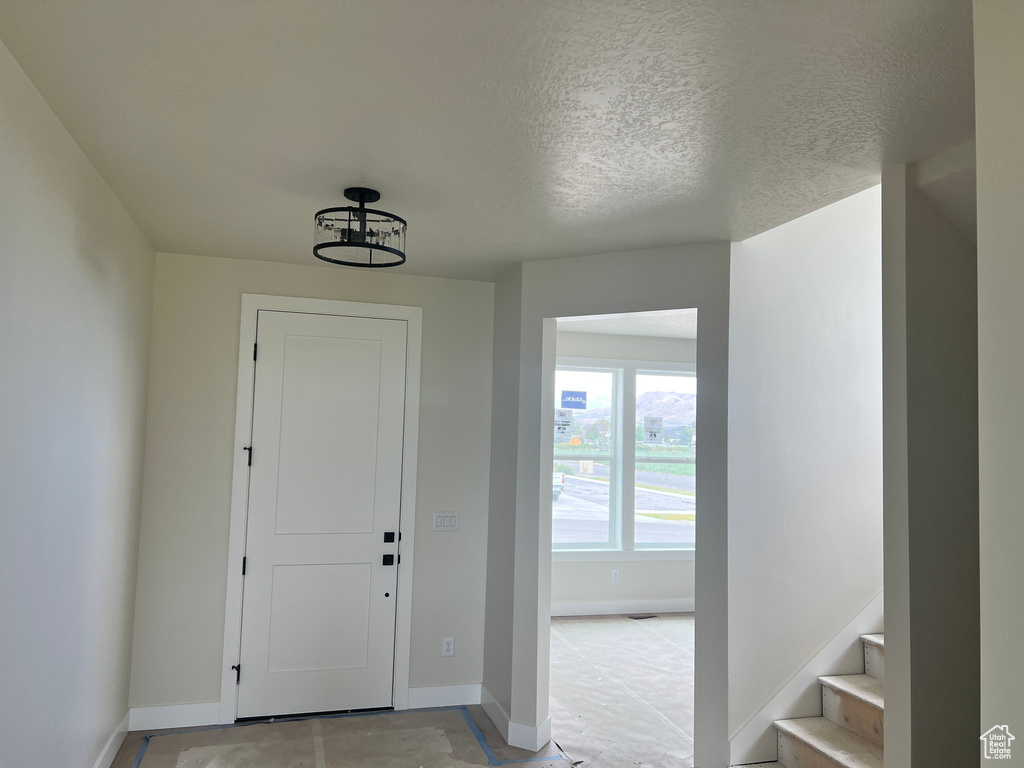 Entrance foyer with a textured ceiling