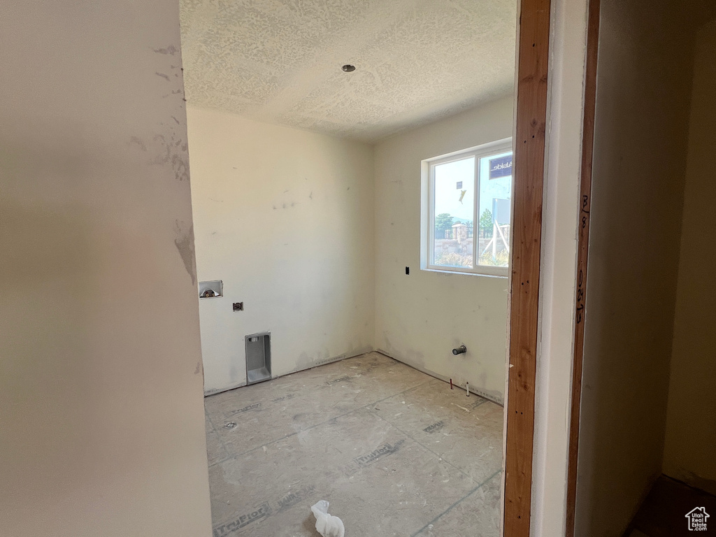 Interior space featuring a textured ceiling