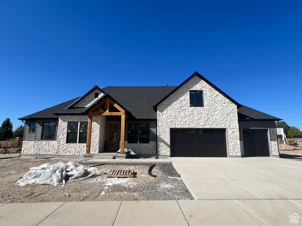 View of front of property with a garage