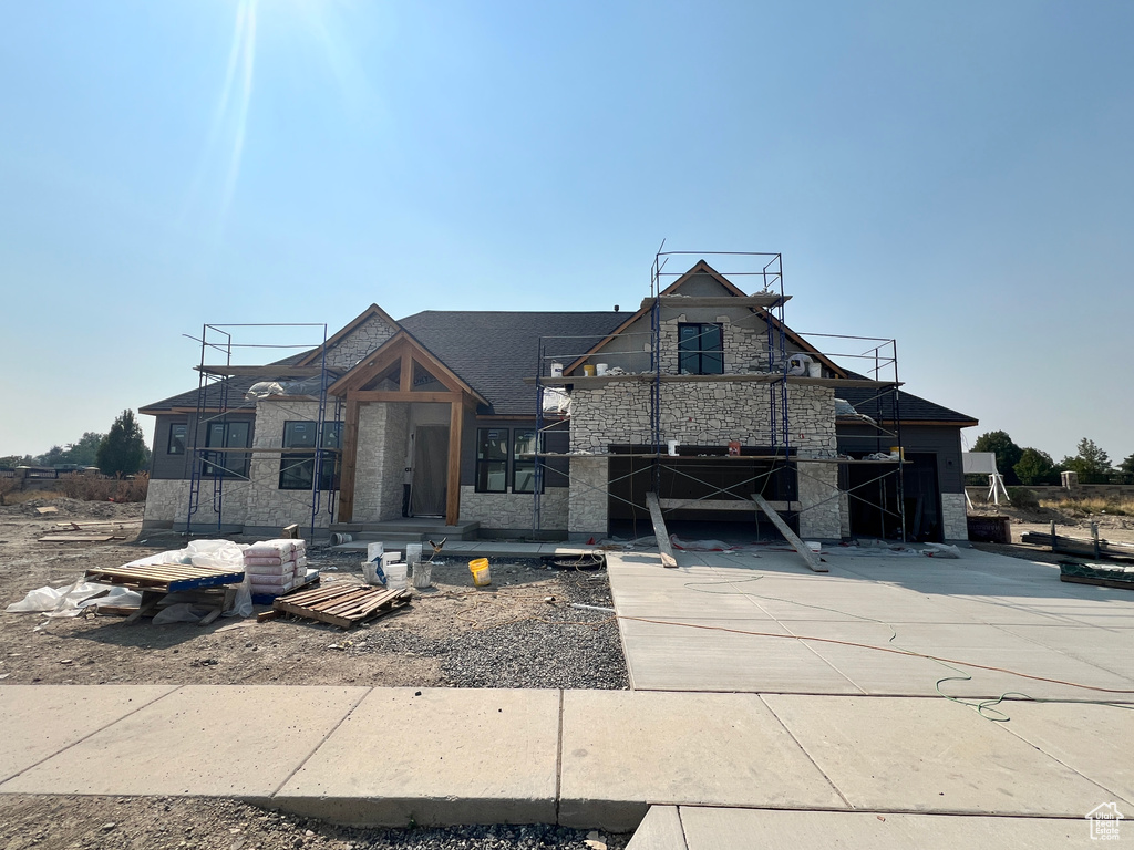 View of front of home featuring a patio area