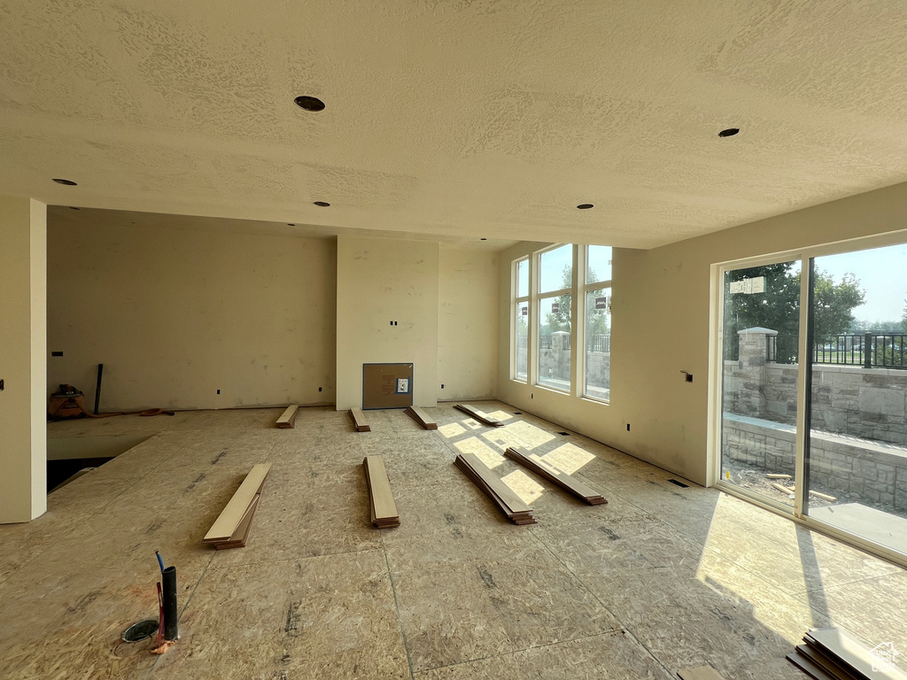 Unfurnished room with a textured ceiling