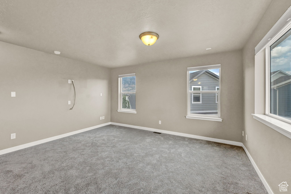 Empty room with carpet floors