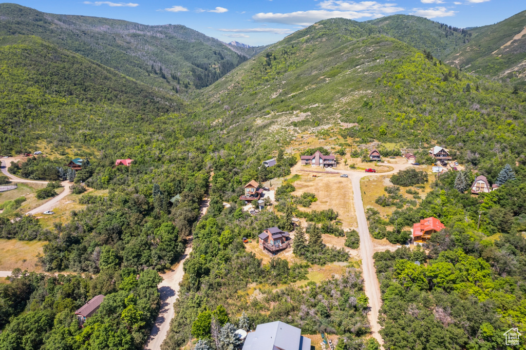 Birds eye view of property with a mountain view