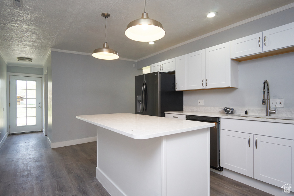 Kitchen with refrigerator with ice dispenser, white cabinets, dishwasher, dark hardwood / wood-style floors, and decorative light fixtures