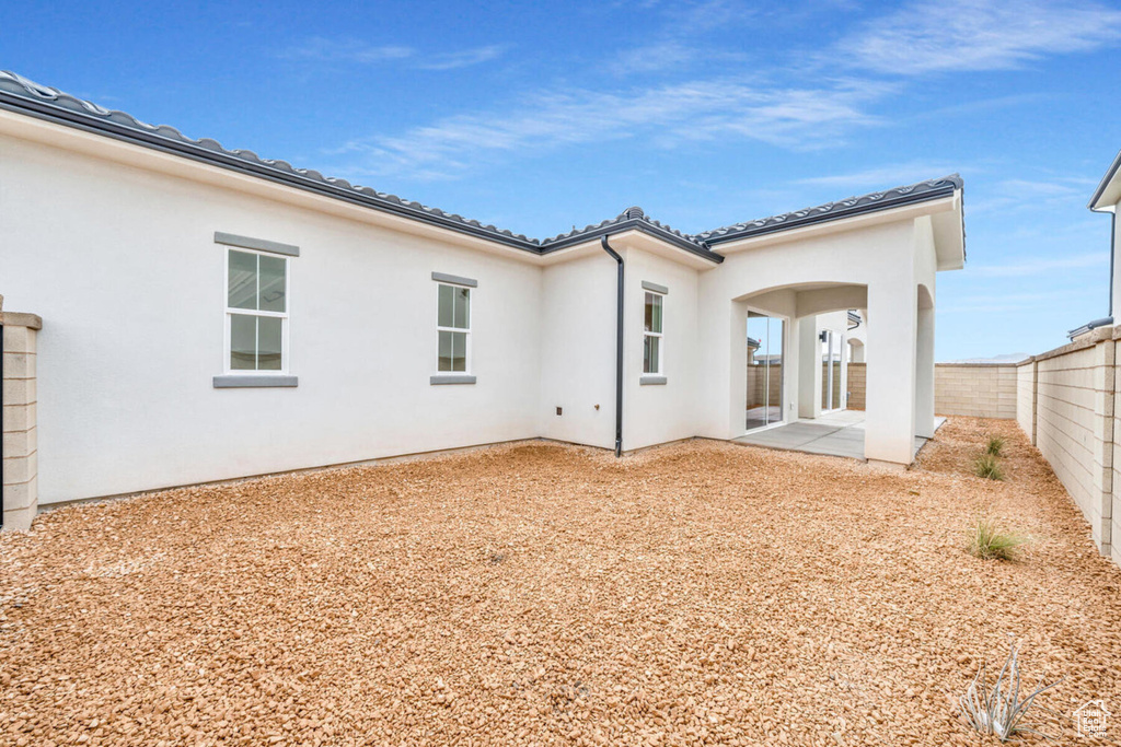 Back of property with a patio