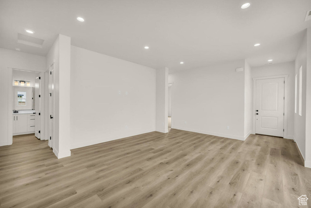 Unfurnished living room with light hardwood / wood-style floors