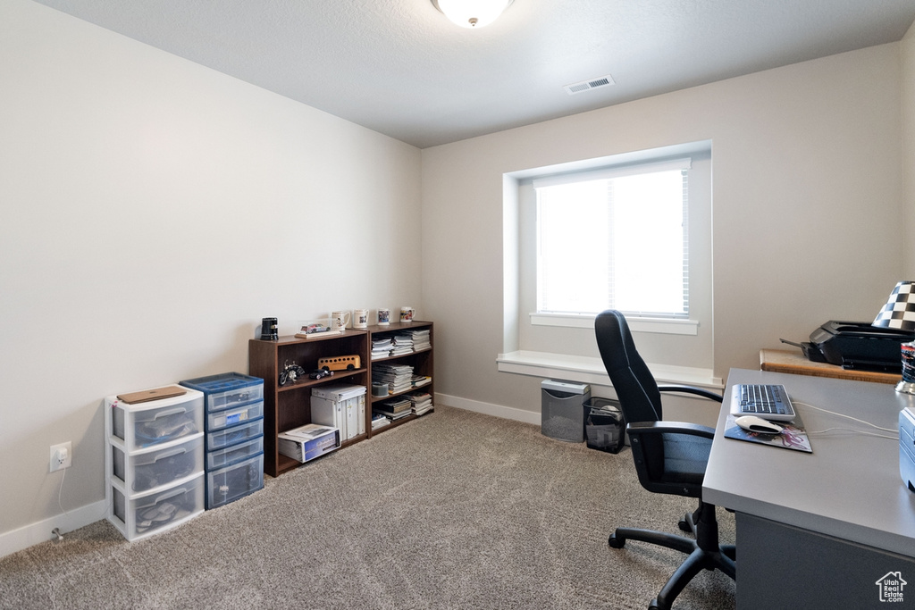 View of carpeted home office