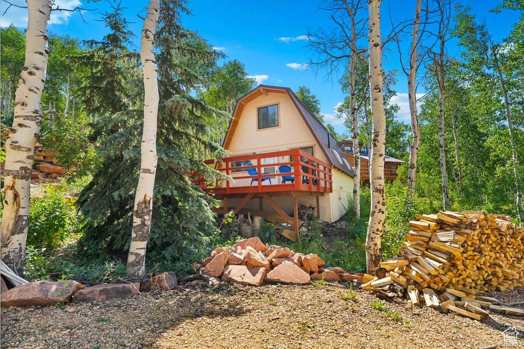 Rear view of house with a wooden deck