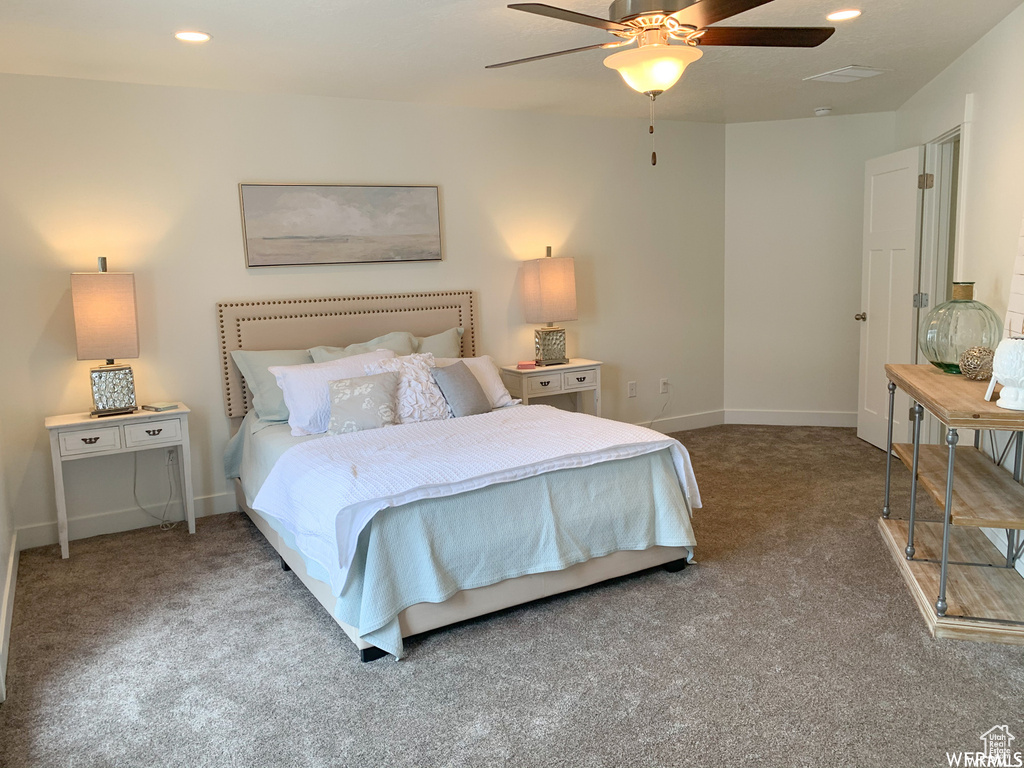 Bedroom with ceiling fan and carpet flooring