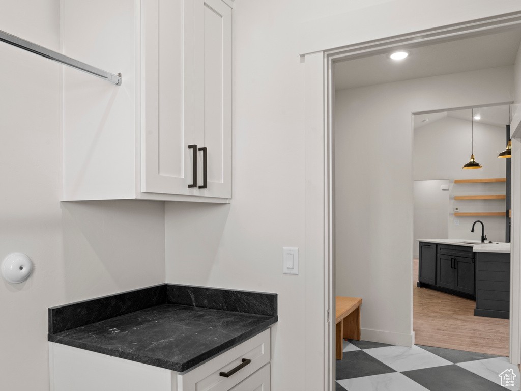 Interior space with vanity and tile patterned floors