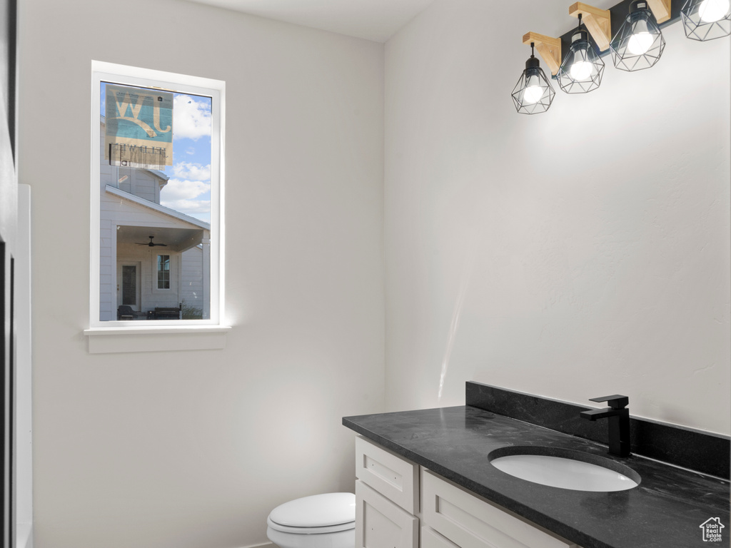 Bathroom with toilet and vanity