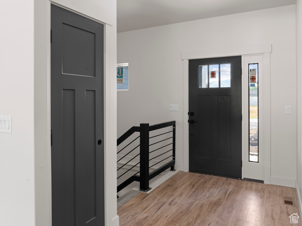 Entryway featuring light hardwood / wood-style floors and a healthy amount of sunlight