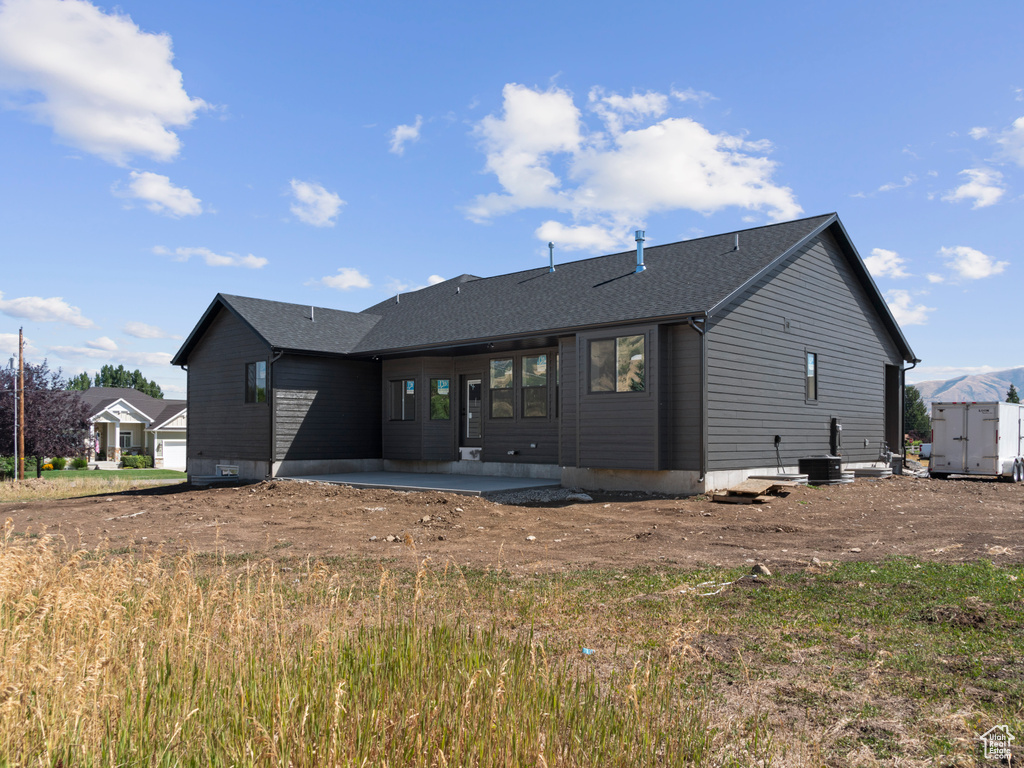 Rear view of house featuring a patio area