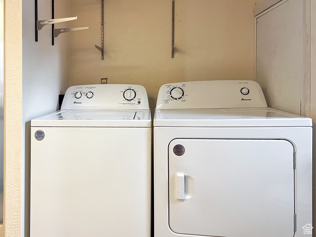 Washroom featuring washer and dryer