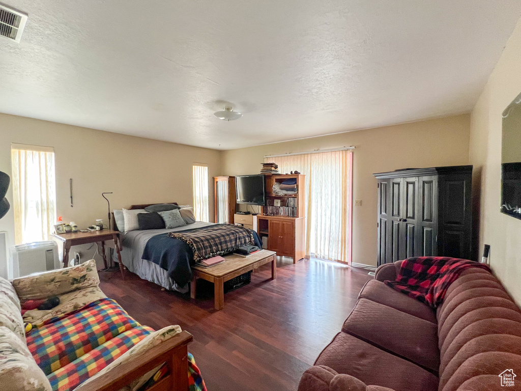 Bedroom featuring dark wood-type flooring