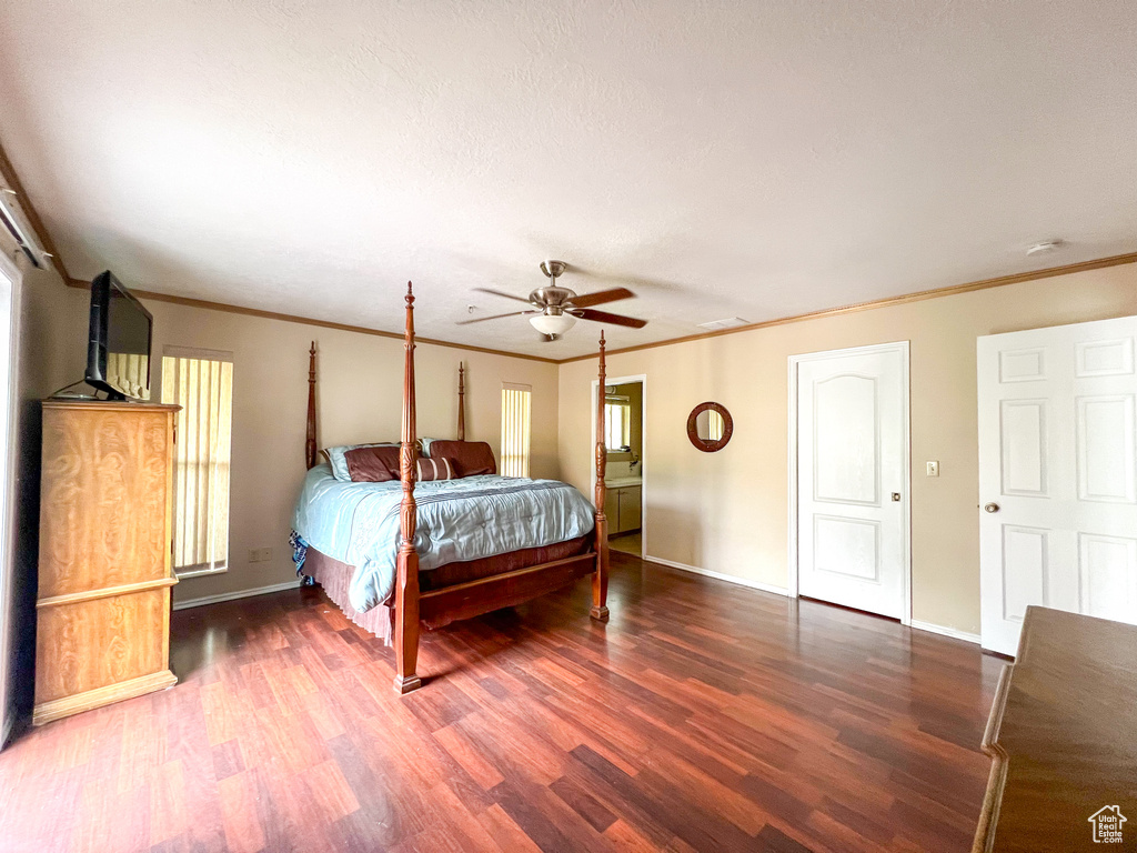 Unfurnished bedroom with ornamental molding, hardwood / wood-style flooring, and ceiling fan