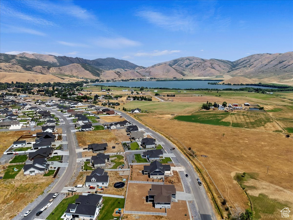 Aerial view featuring a water and mountain view