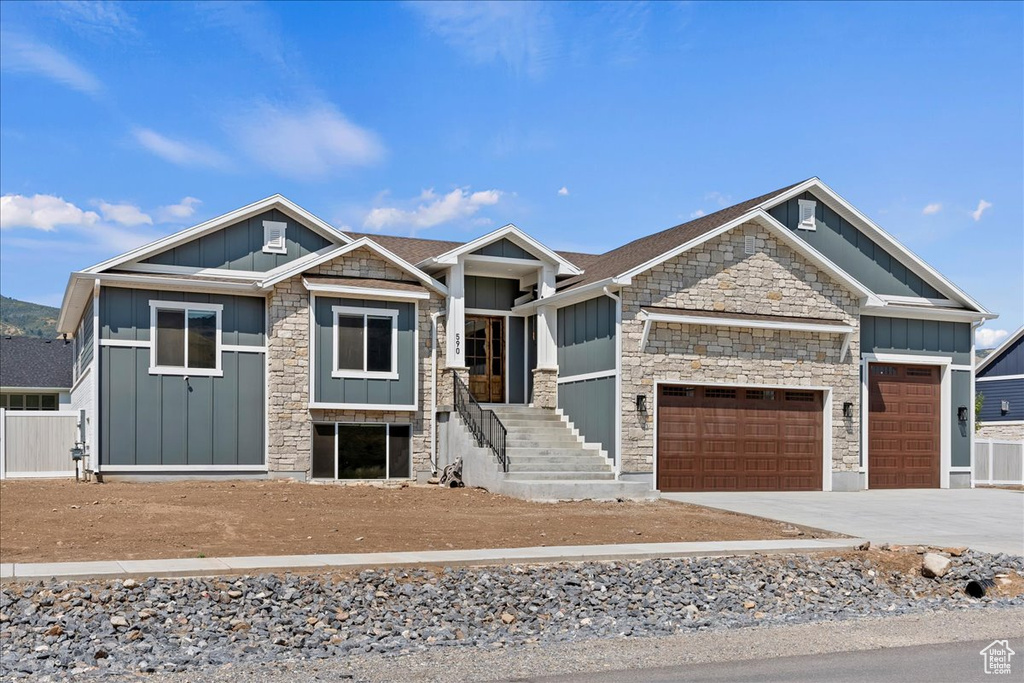 Craftsman-style home featuring a garage