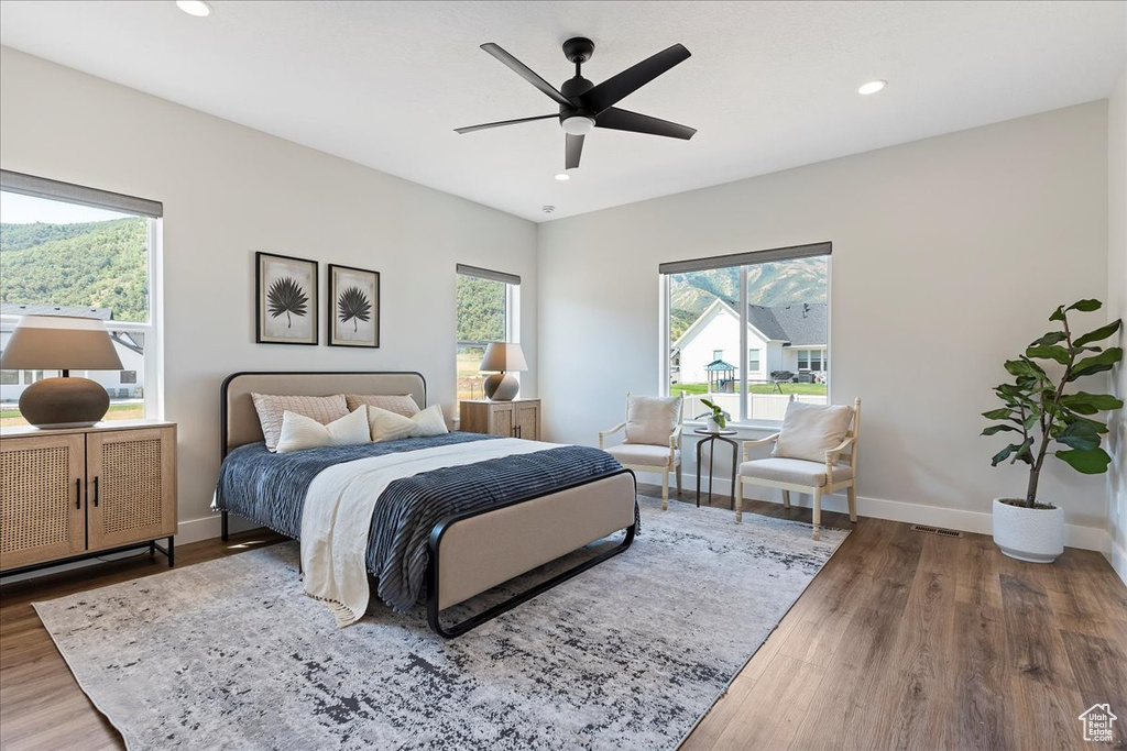 Bedroom with wood-type flooring and ceiling fan