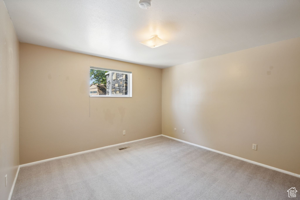 Empty room featuring carpet flooring