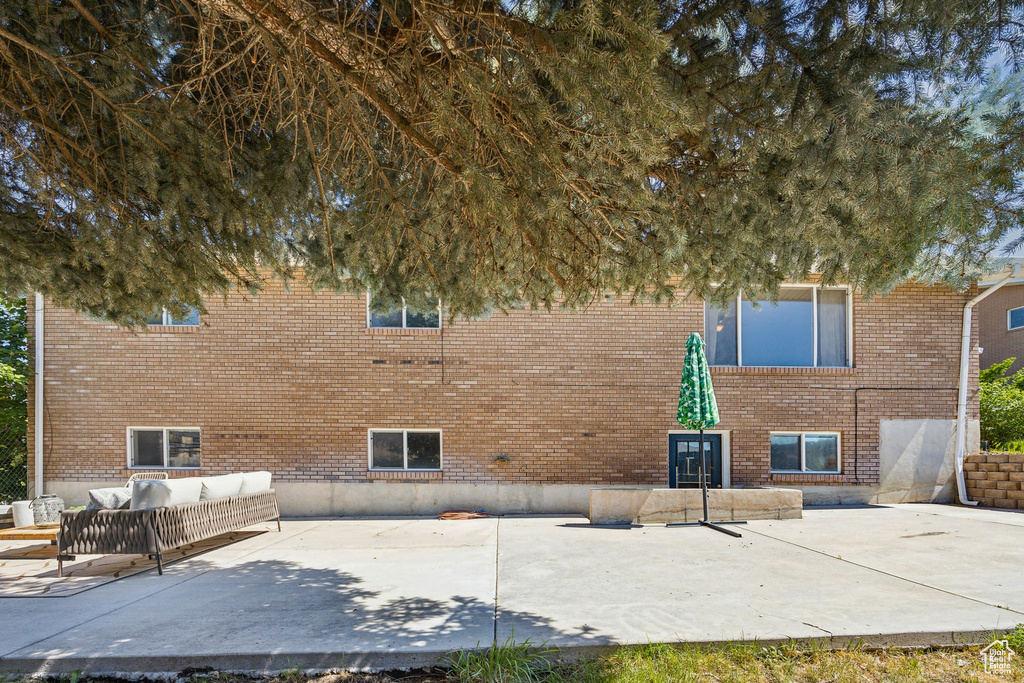 Exterior space featuring a patio and an outdoor living space