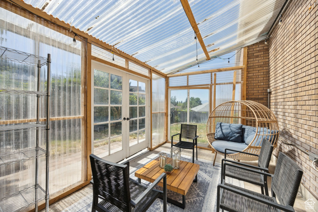 Sunroom / solarium with french doors and lofted ceiling