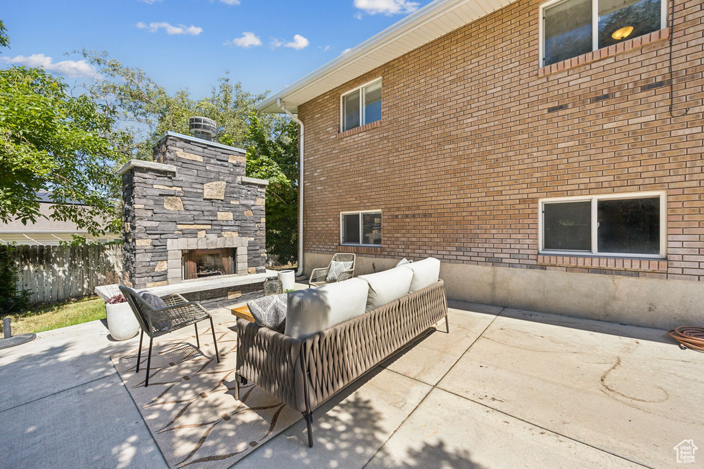 View of patio / terrace featuring an outdoor living space with a fireplace