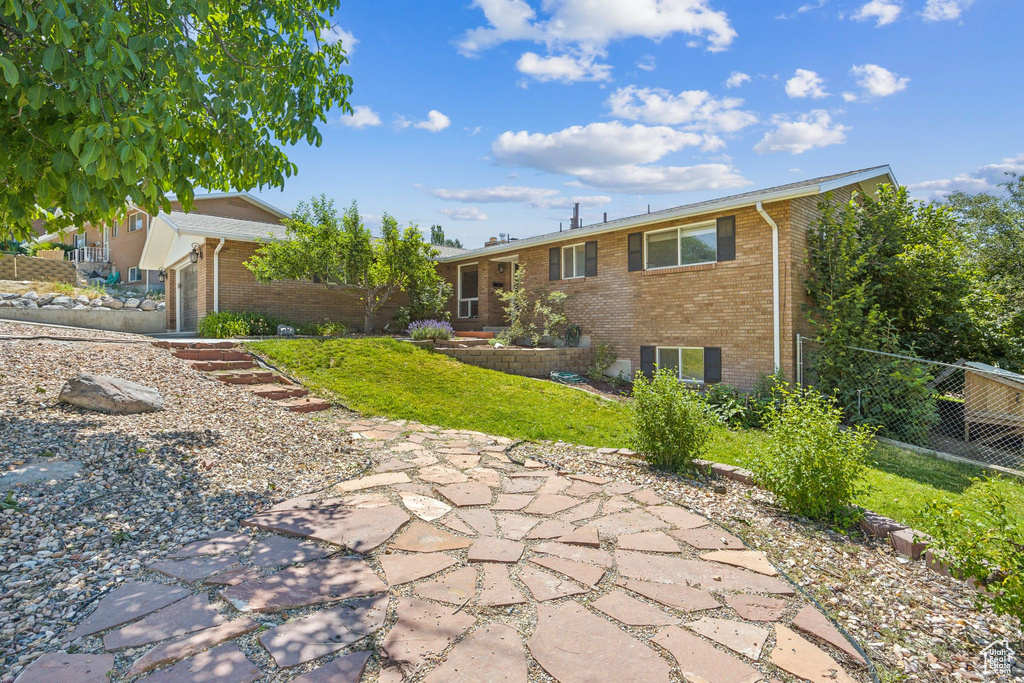 Back of house with a patio area