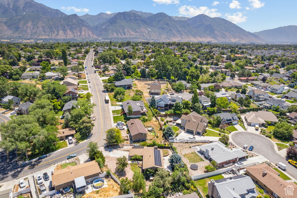 Birds eye view of property with a mountain view