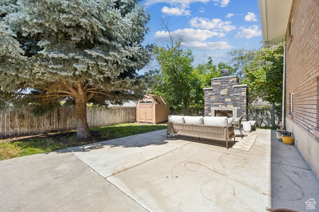 View of patio / terrace featuring a storage shed