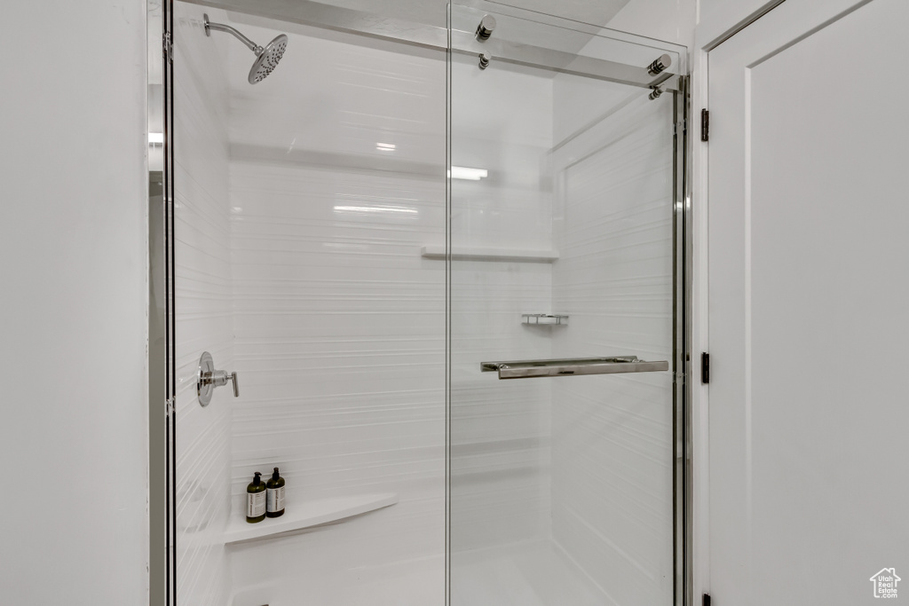 Bathroom with a shower with shower door