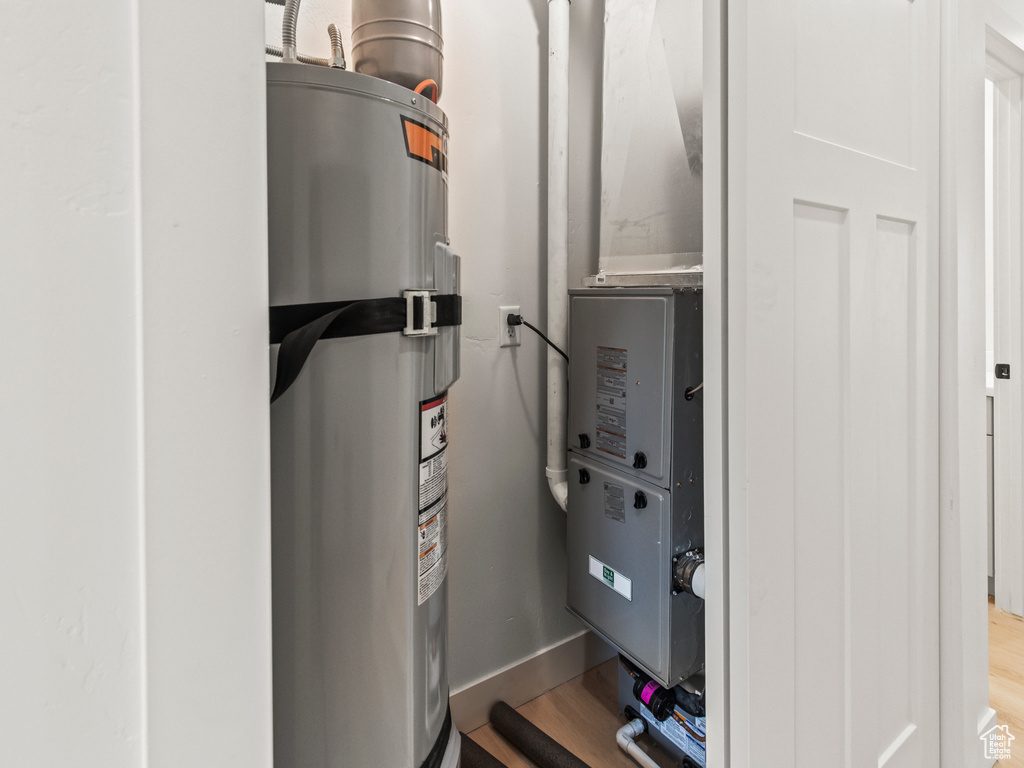 Utility room featuring gas water heater