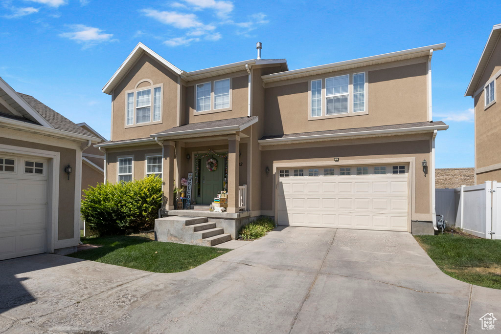 View of front of property with a garage