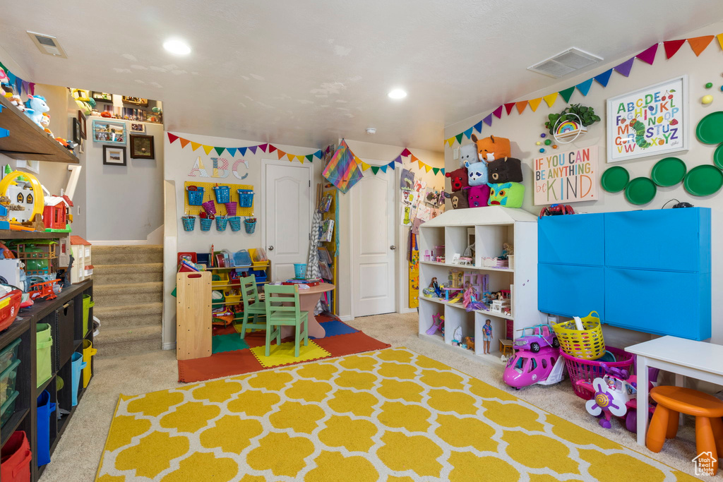 Playroom featuring light colored carpet