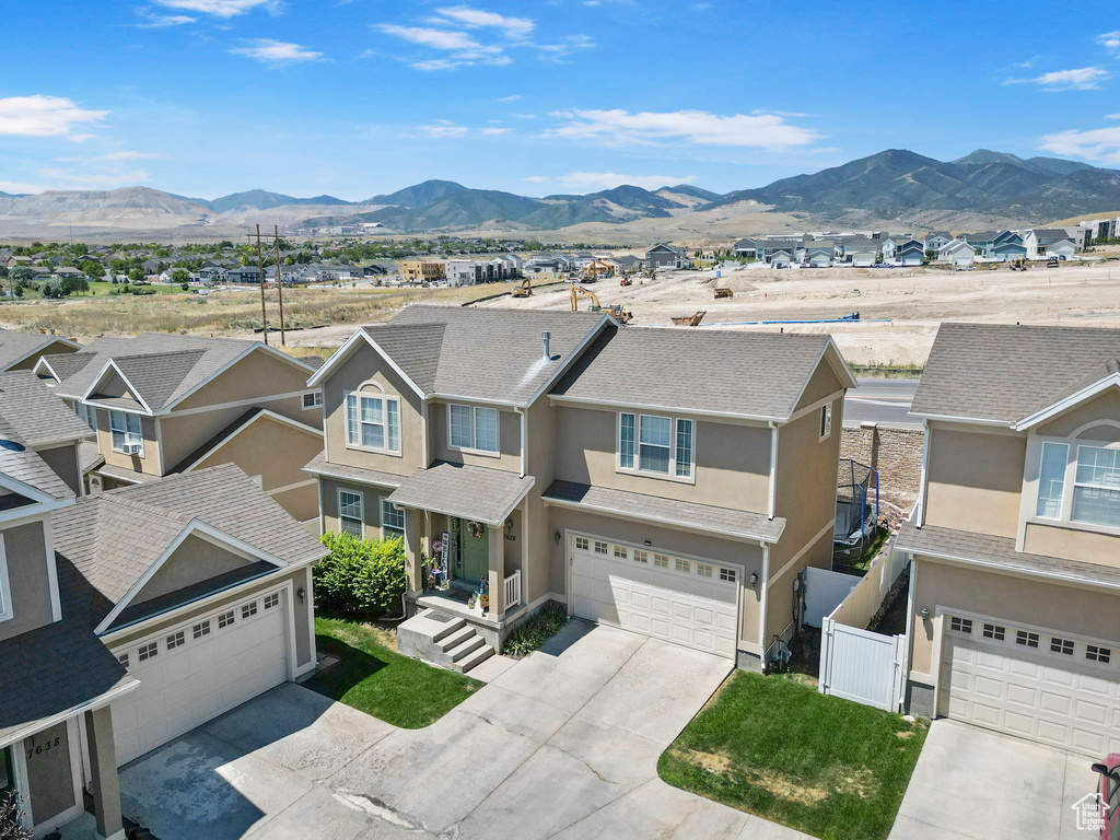 Birds eye view of property with a mountain view