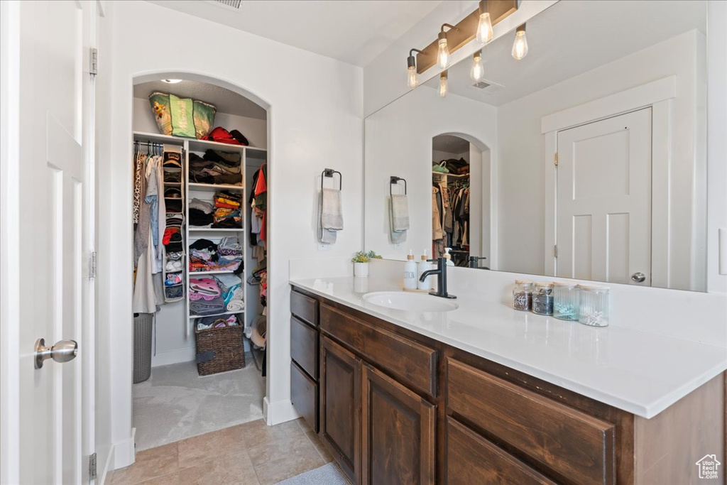 Bathroom featuring vanity and tile patterned floors