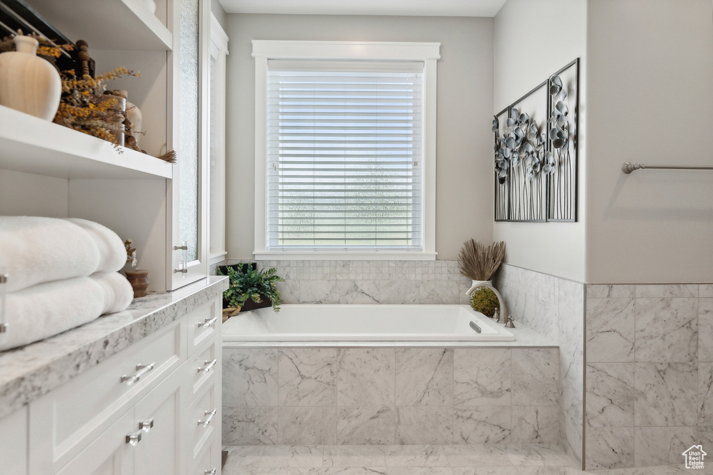 Bathroom featuring a relaxing tiled tub