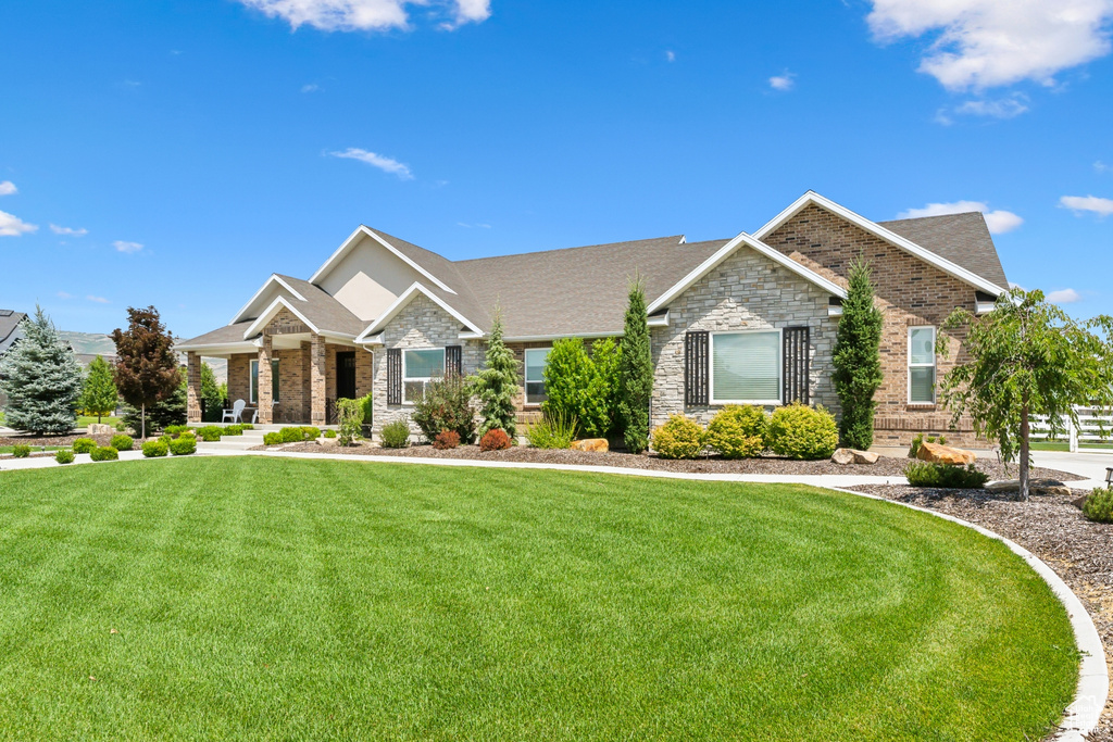 Craftsman house with a front lawn