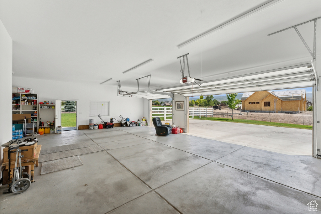 Garage featuring a garage door opener