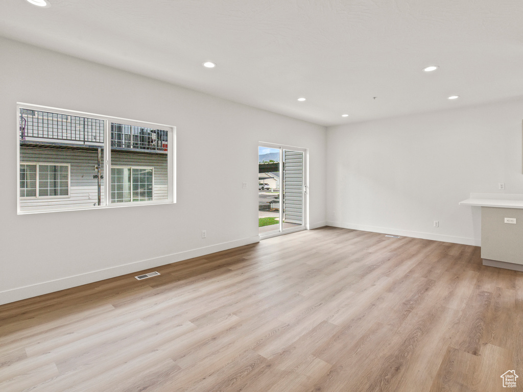 Spare room featuring light wood-type flooring