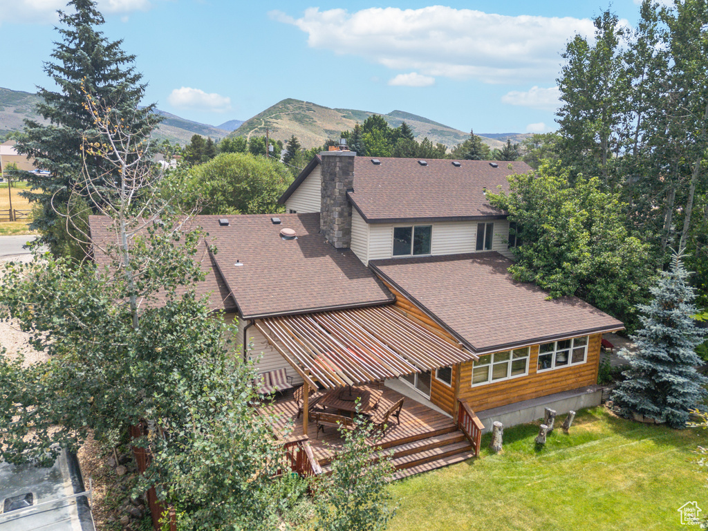 Birds eye view of property with a mountain view