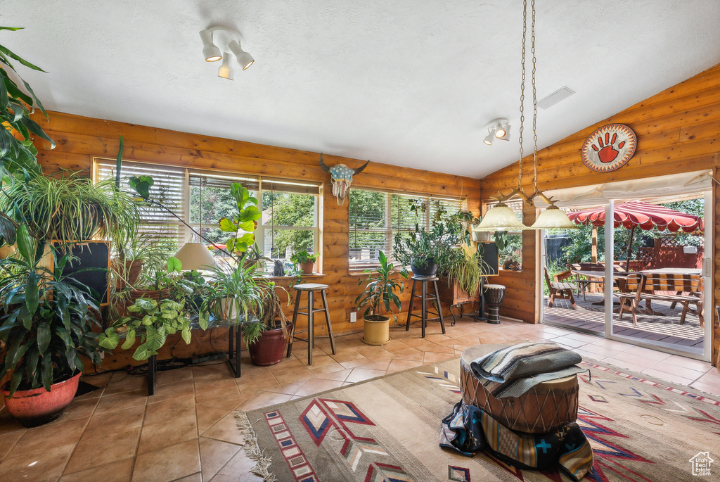 Sunroom with lofted ceiling