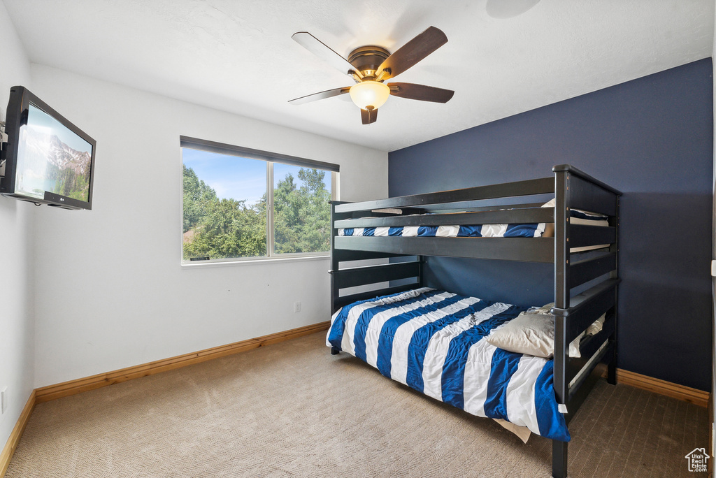 Bedroom featuring carpet flooring and ceiling fan